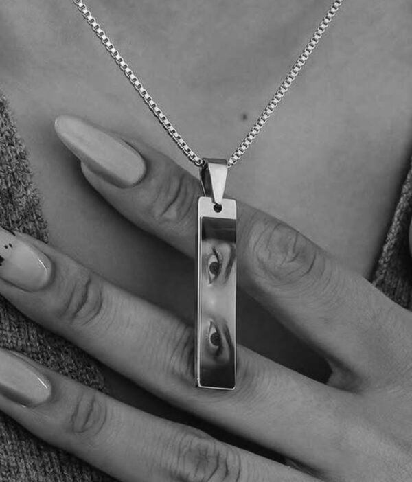 Close up of silver custom pendant with cubic zirconia gemstone by Stree World